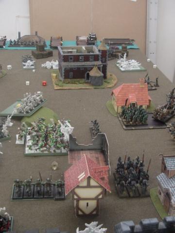 The wall of orcs has reached the middle of the table!